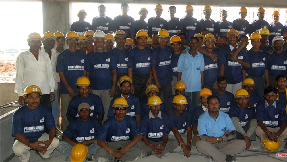 Premier workforce in safety helmets assembled at a plant site