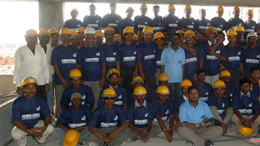 Uniformed workforce and supervisors assembled on site at an industrial facility