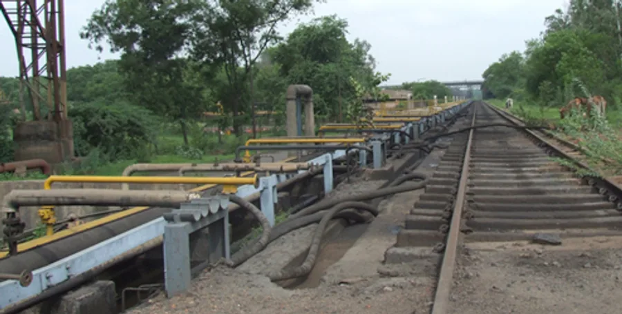 Railway track running through an industrial materials handling yard