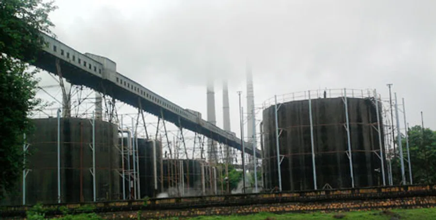 Large storage tanks, pipe racks and conveyor gantries at a heavy process plant
