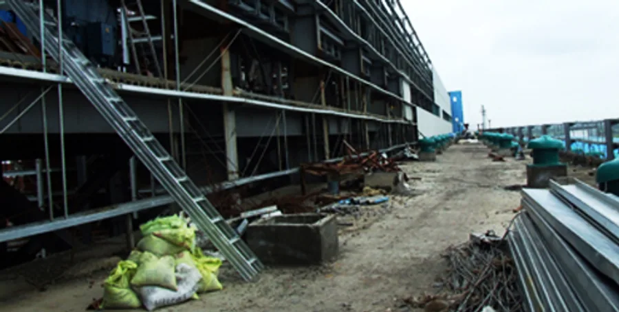 Structural steel framework and conveyor gantry under erection viewed from below